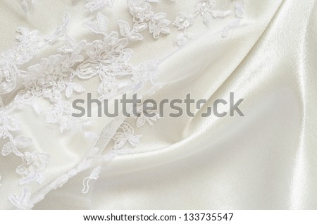 White wedding satin and embroidered lace