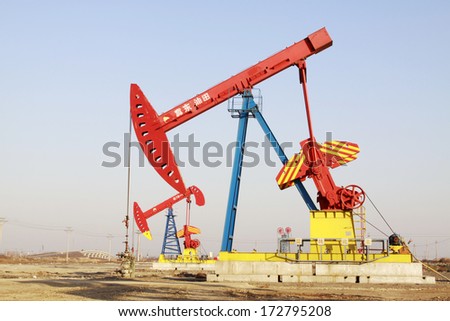 CAOFEIDIAN - DECEMBER 1: The crank balanced beam pumping unit in the JiDong oilfield, on December 1, 2013, caofeidian, hebei province, China.