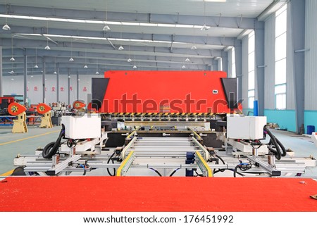 TANGSHAN - DECEMBER 22: Machinery and equipment in the workshop, in a solar equipment manufacturing enterprises on december 22, 2013, tangshan, china.