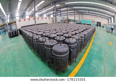TANGSHAN - DECEMBER 22: Pressure tank put in a warehouse workshop, in a solar equipment production workshop on december 22, 2013, tangshan, china.