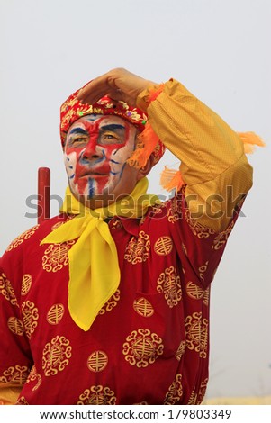 LUANNAN COUNTY - FEBRUARY 15: Sun wukong\'s image wearing colorful clothes, performing yangko dance in the street, February 15, 2014, Luannan County, Hebei Province, China.