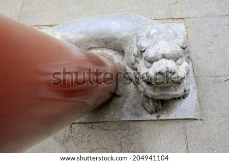 BEIJING - MAY 23: Animal sculptures and red pillars in the Beihai Park, on may 23, 2014, Beijing, China