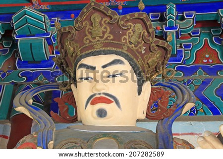 BEIJING - MAY 23: Buddhist heavenly king statues in the Beihai Park, on may 23, 2014, Beijing, China