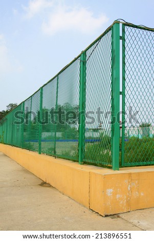 metal fence in a playground, closeup of photo