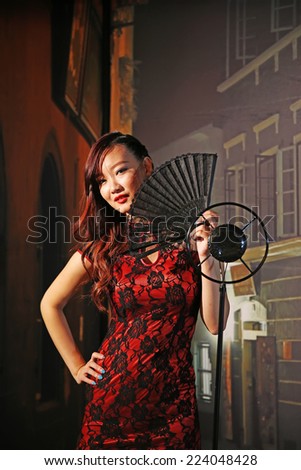 TANGSHAN CITY - AUGUST 27: a lady sings in the bar, on august 27, 2014, Tangshan City, Hebei Province, China