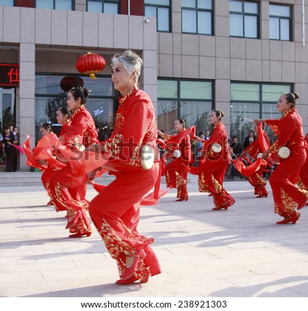 LUANNAN COUNTY - SEPTEMBER 27: Old women waist drum performances at the National Day party, on september 27, 2014, Luannan County, Hebei Province, China