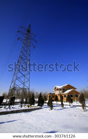 Pylon and cabin in the snow, closeup of photo