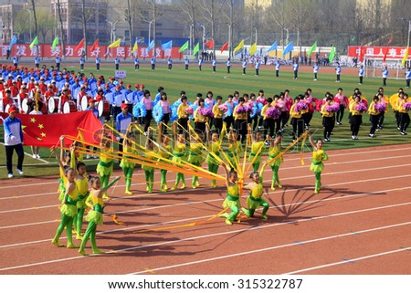 LUANNAN COUNTY - APRIL 14: Group gymnastic performance at the athletics meeting, April 14, 2015, Luannan County, Hebei Province, China