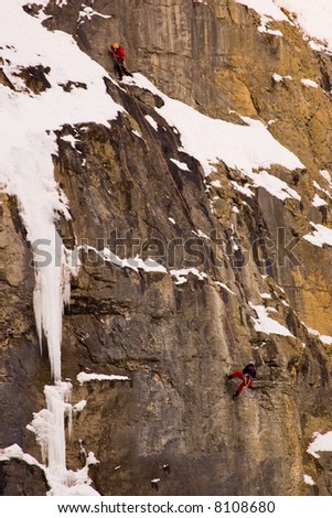 Two climbers on cliff in Banff National Park.