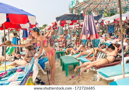 PATTAYA, THAILAND - JANUARY 18, 2014: russian tourists in a dedicated area at Samae Beach, in Ko Lan ( Larn Island ). In March 2007 Thailand and Russia entered into a mutual visa waiver program.