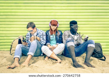 Group of young multiracial friends with smartphone and mutual disinterest towards each other - Social situation of new technology interaction in alienated lifestyle - Vintage nostalgic filtered look