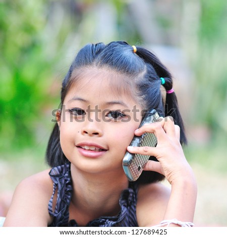 Little girl talking on the phone