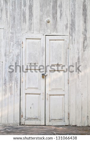 grunge old white door with lock