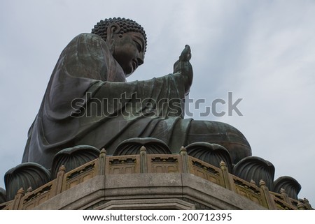 HONG KONG - JUNE 21: Tian Tan Giant Buddha , situated on Ngong Ping plateau,  on June 21 2014. It is a major of Buddhism ,is the centre of Lantau is a popular tourist is also  attraction in Hong Kong