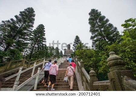 HONG KONG - JUNE 21: Tian Tan Giant Buddha , situated on Ngong Ping plateau,  on June 21 2014. It is a major of Buddhism ,is the centre of Lantau a popular tourist is also  attraction in Hong Kong
