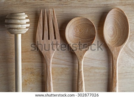 kitchen food styling , 4 utensils lying objects on old wood plate