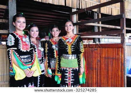 KOTA KINABALU, MALAYSIA - MAY 30, 2015: Young girls from Kadazandusun tribe in their traditional costume during the Sabah State Harvest festival celebration in Kota Kinabalu, Sabah Borneo, Malaysia.
