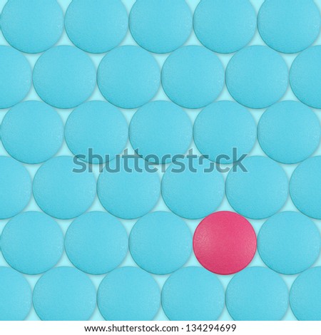 Abstract background with red pill between blue pills