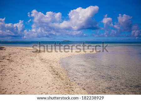 Ideal tropical beach with turquoise water and white sand on a desert island