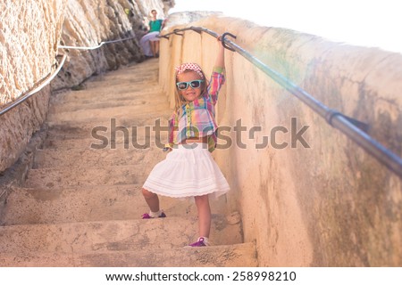 Adorable little girl outdoors in European city