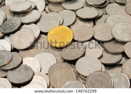 A gold coin and silver coins