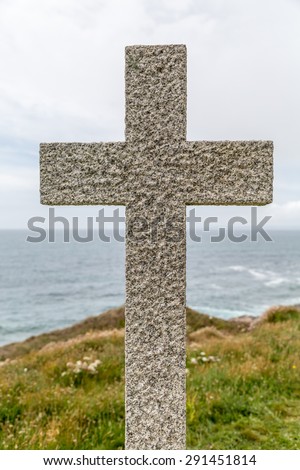 Granite cross looking out to sea near porthleven