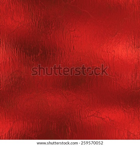 Red Foil Seamless and Tileable Luxury background texture. Glamour and glittering holiday wrinkled red foil background.
