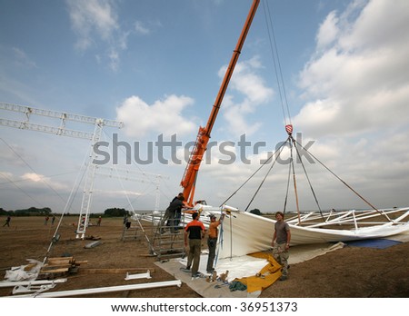 BRNO, CZECH REPUBLIC – SEPT 12: Workers prepare a canopy for the platform of Pope Benedict XVI on September 12, 2009 in Brno Czech republic. The Pope is scheduled to visit the area from Sept 26-28.