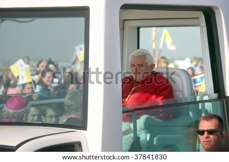 BRNO - SEPT 27: Holy father Pope Benedict XVI smiles as he greets about 120,000 pilgrims from central Europe as he travels in the Pope Mobile on mass on September 27, 2009 in Brno, Czech Republic.