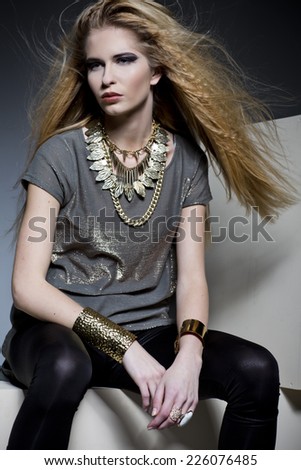 Fashion Rocker Style Model Girl Portrait. Hairstyle. Rocker or Punk Woman Makeup