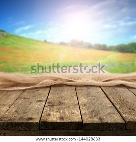 sun blue sky and wooden table