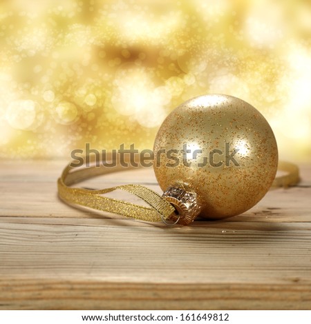 gold ball and gold ribbon