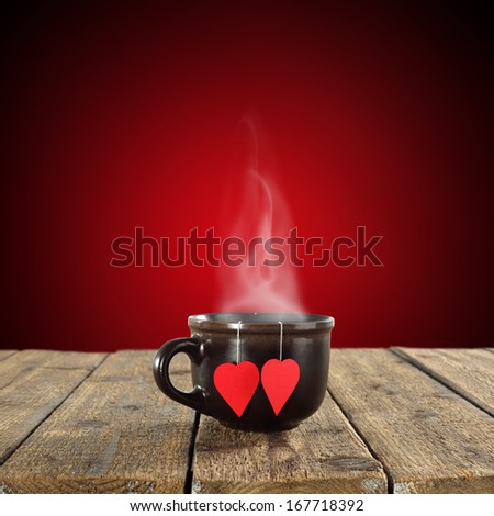 big brown mug and two hearts on table