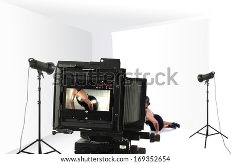 black camera in studio of white
