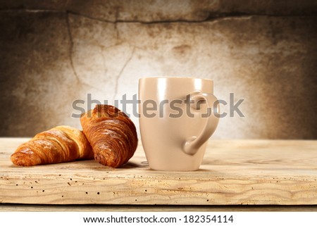 croissant and coffee mug