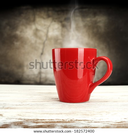 warm red mug white shabby desk and wall