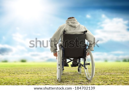 men on wheelchair and grass of green with sky of sun