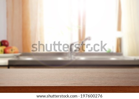 dark desk and kitchen desk with window