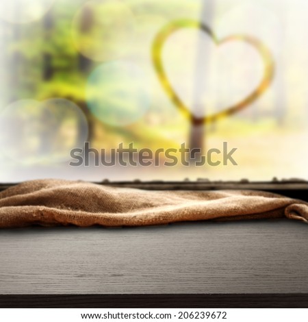 window sill of black color and heart of love in autumn space
