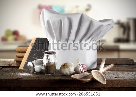 decoration of cook hat spoons books and kitchen