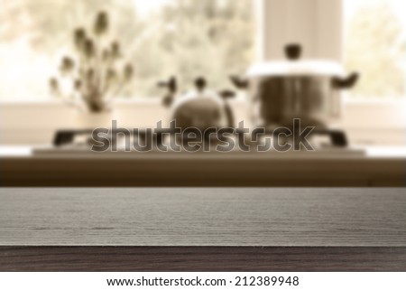desk of dark top and kitchen