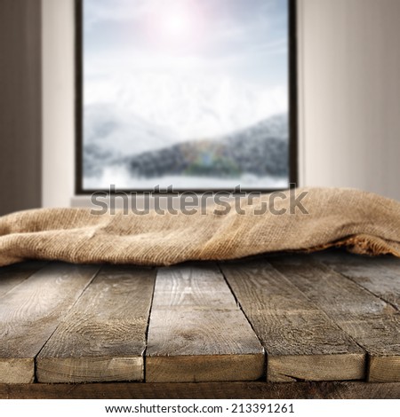 worn old table place and window space with blue landscape