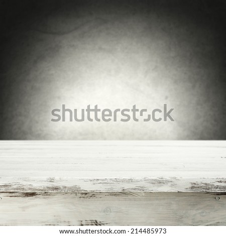 white table of wood space and gray space of wall
