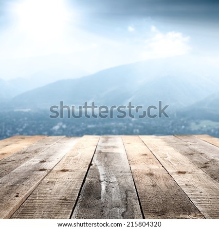 wooden floor of gray and blue landscape of sun and mountains