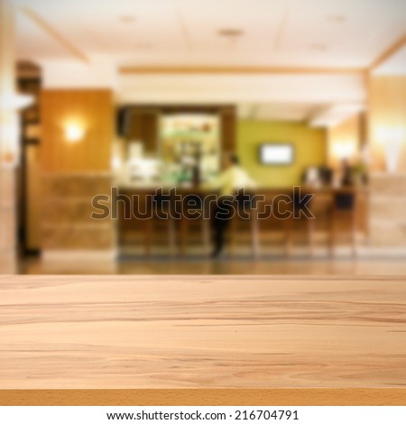 wooden yellow desk of bar and free space for you in hotel