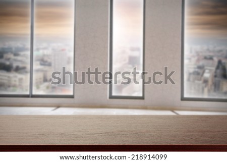 top of desk in office and landscape of town