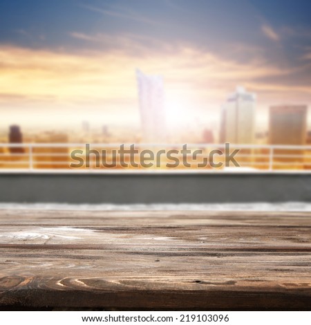 wooden deck and terrace of city landscape with sun