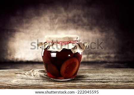 red food in jar on desk