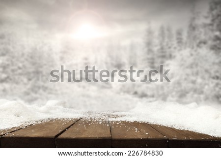 dark brown table top of snow and forest of snow
