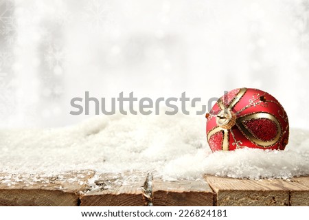 winter red ball of snow and silver background